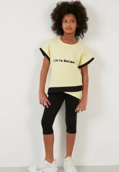 LELA REGULAR FIT - Leggings - Yellow/black, Niños