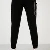 LELA Pantalones Deportivos - Black , Mujer