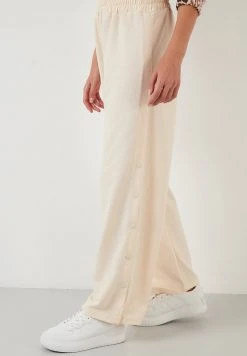 LELA Pantalones Deportivos - Stone Colored , Mujer -LELA Tienda fdb081360a2e466c8ac2bfd42baf301e